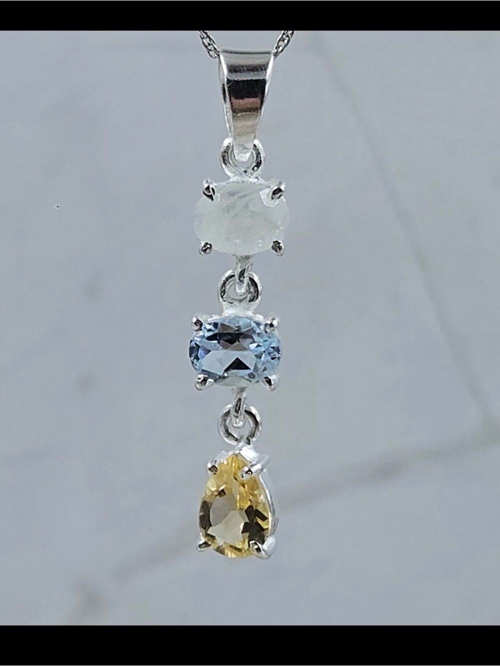 Sterling Silver Tri-Stone Pendant Necklace with White, Blue and Yellow Gemstones